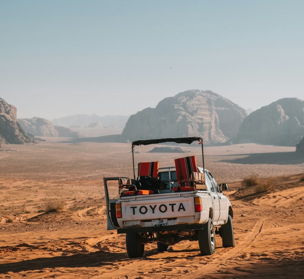 white-toyota-crew-cab-truck-on-desert-during-daytime-se9tqcesc2u You see these kinds of pickups all around in the Wadi Rum desert. They complement the landscape so well.